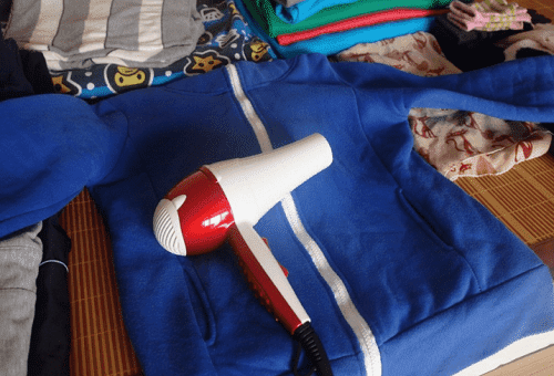 sécher les vêtements avec un sèche-cheveux