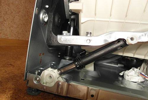 Amortisseur dans une machine à laver