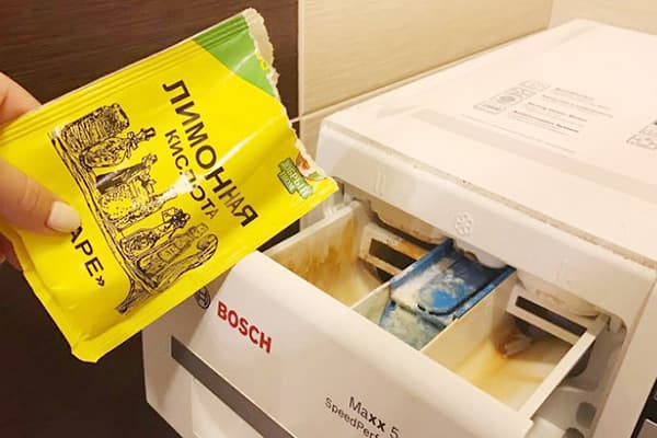 Ajouter de l'acide citrique dans le bac de la machine à laver