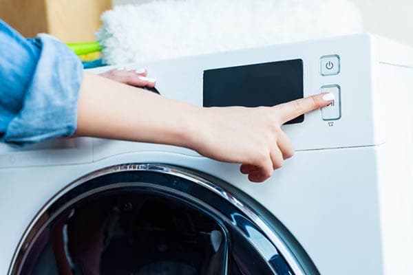 Allumer la machine à laver