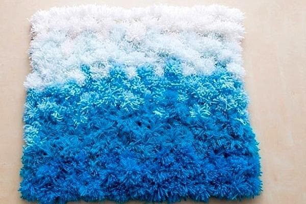 Tapis Vague de mer composé de pompons