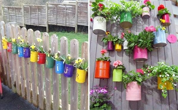 Fleurs dans des boîtes de conserve peintes à la datcha