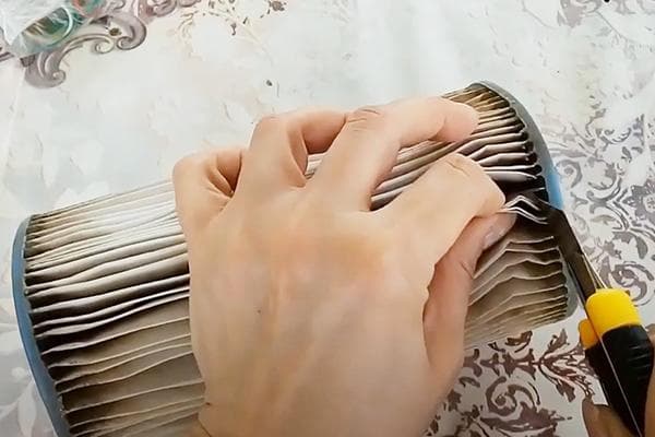 Retrait du matériau filtrant de la cartouche